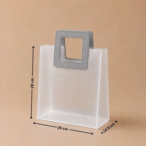 White paper bag with gray handles and measurements on a beige background