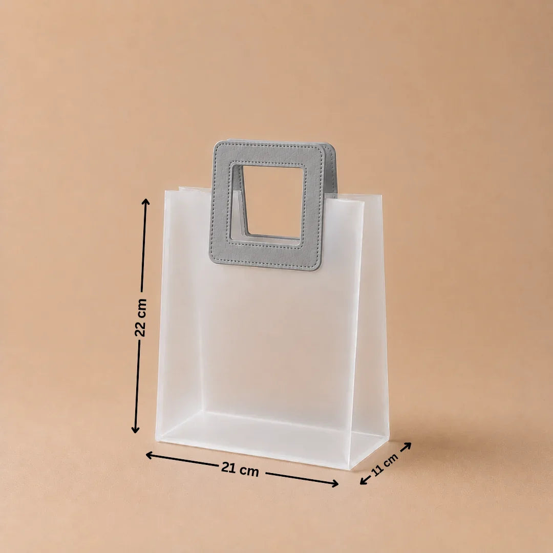 White paper bag with a gray handle and measurements on a beige background