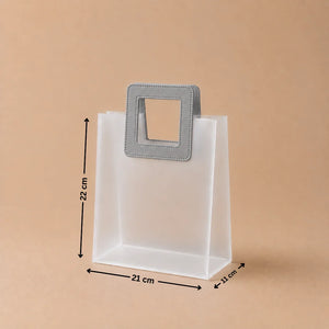 White paper bag with a gray handle and measurements on a beige background