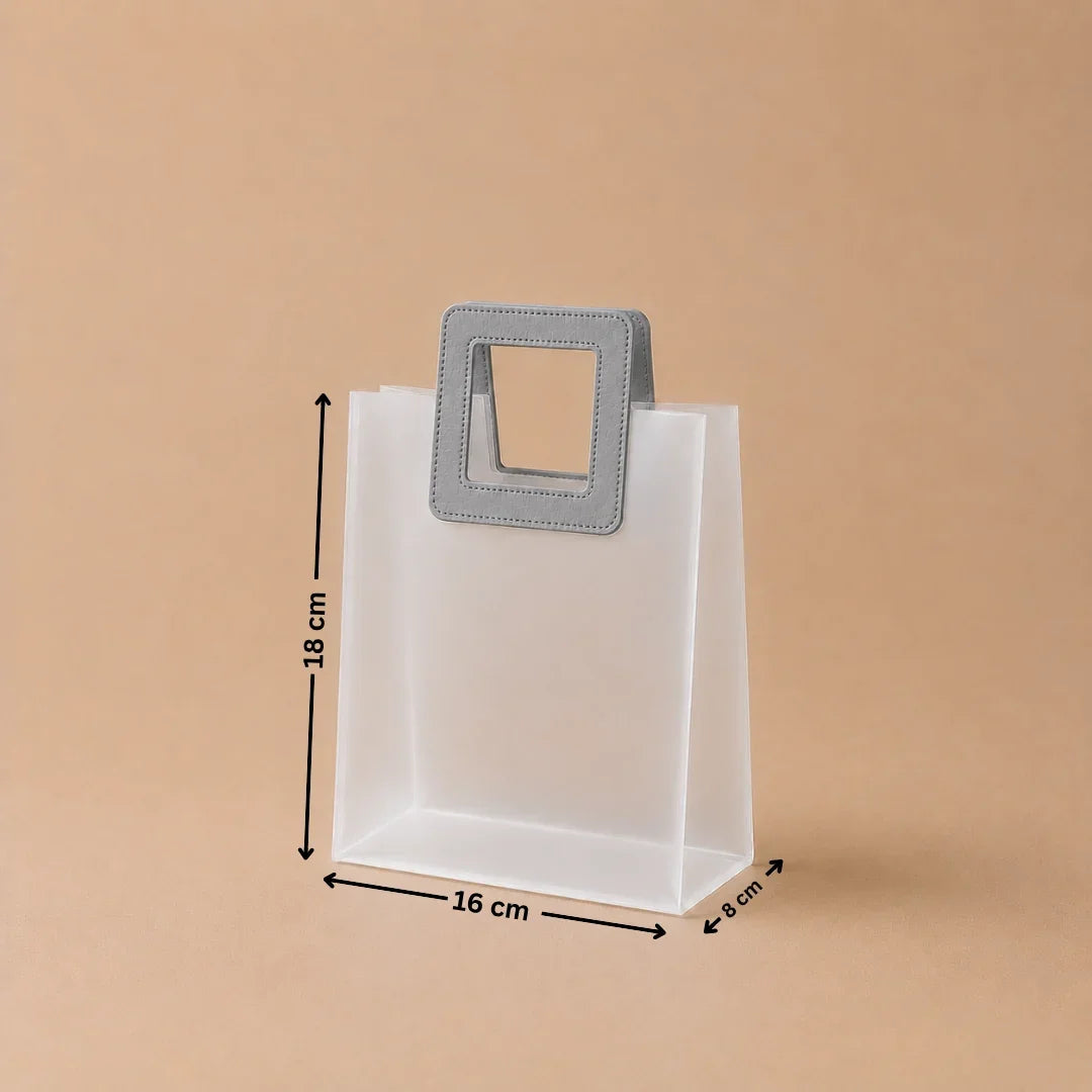 White paper bag with a gray handle and dimensions on a beige background