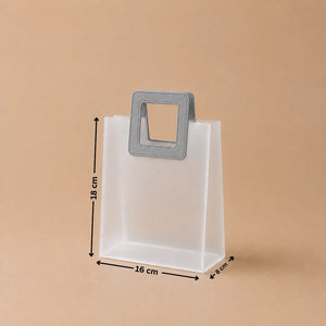 White paper bag with a gray handle and dimensions on a beige background