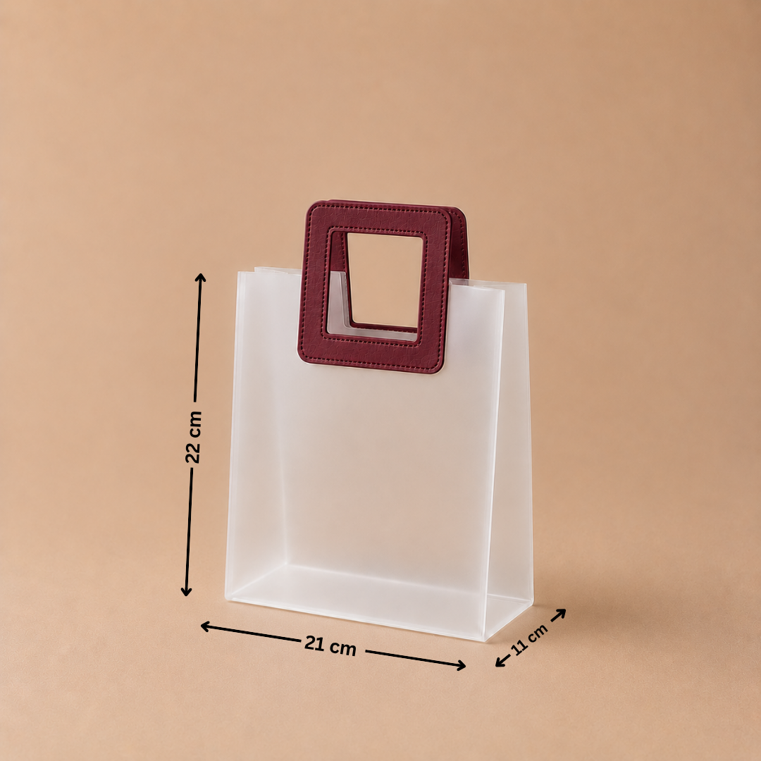 White paper bag with a maroon handle and measurements on a beige background