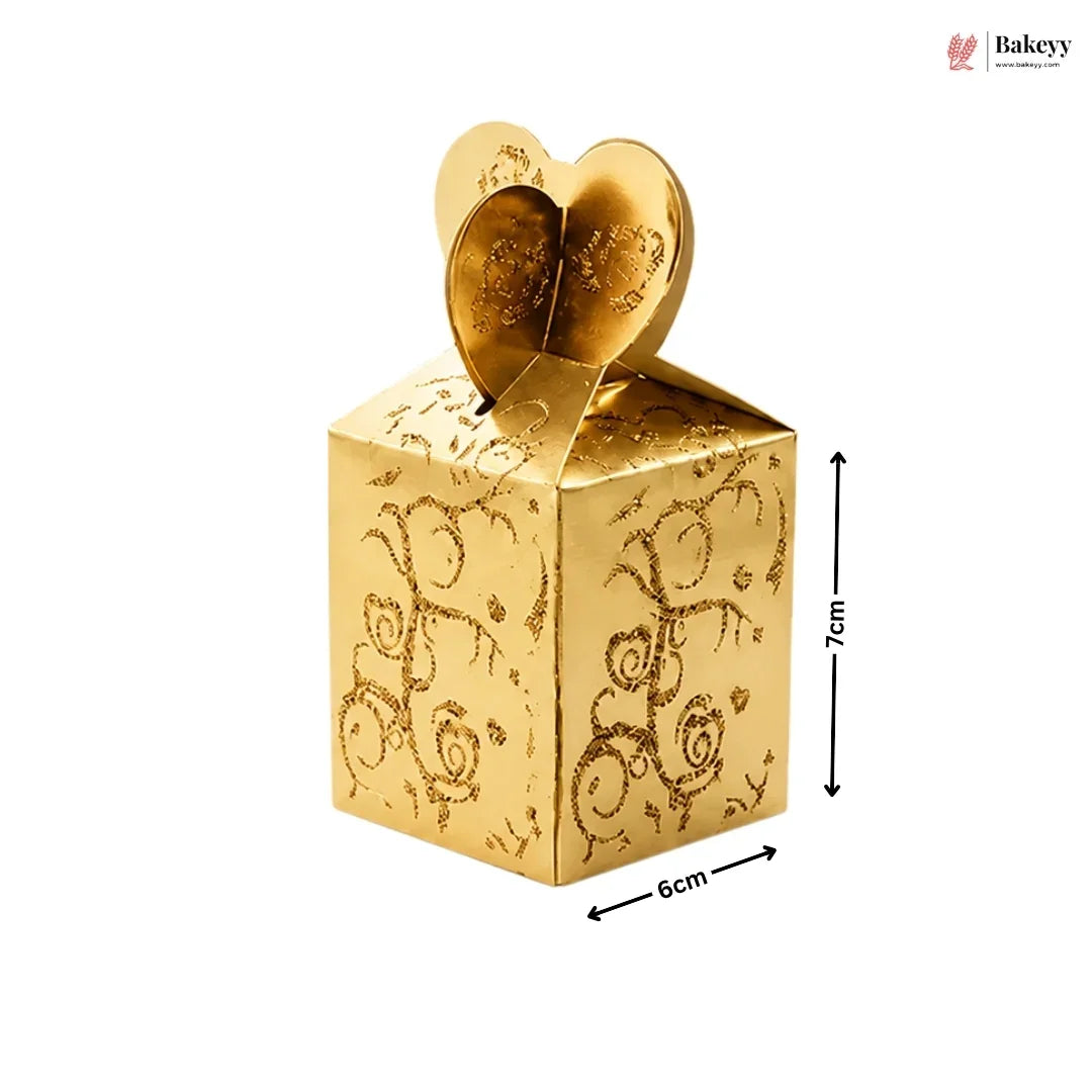 Gold decorative box with heart design and dimensions on a white background