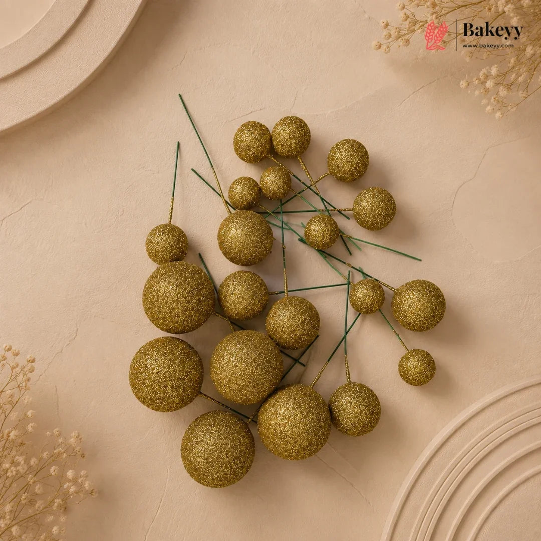 Decorative gold spherical berries on a beige background with 'Bakeyy' branding.
