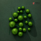 Green decorative balls on a dark green background with 'Bakeyy' branding.