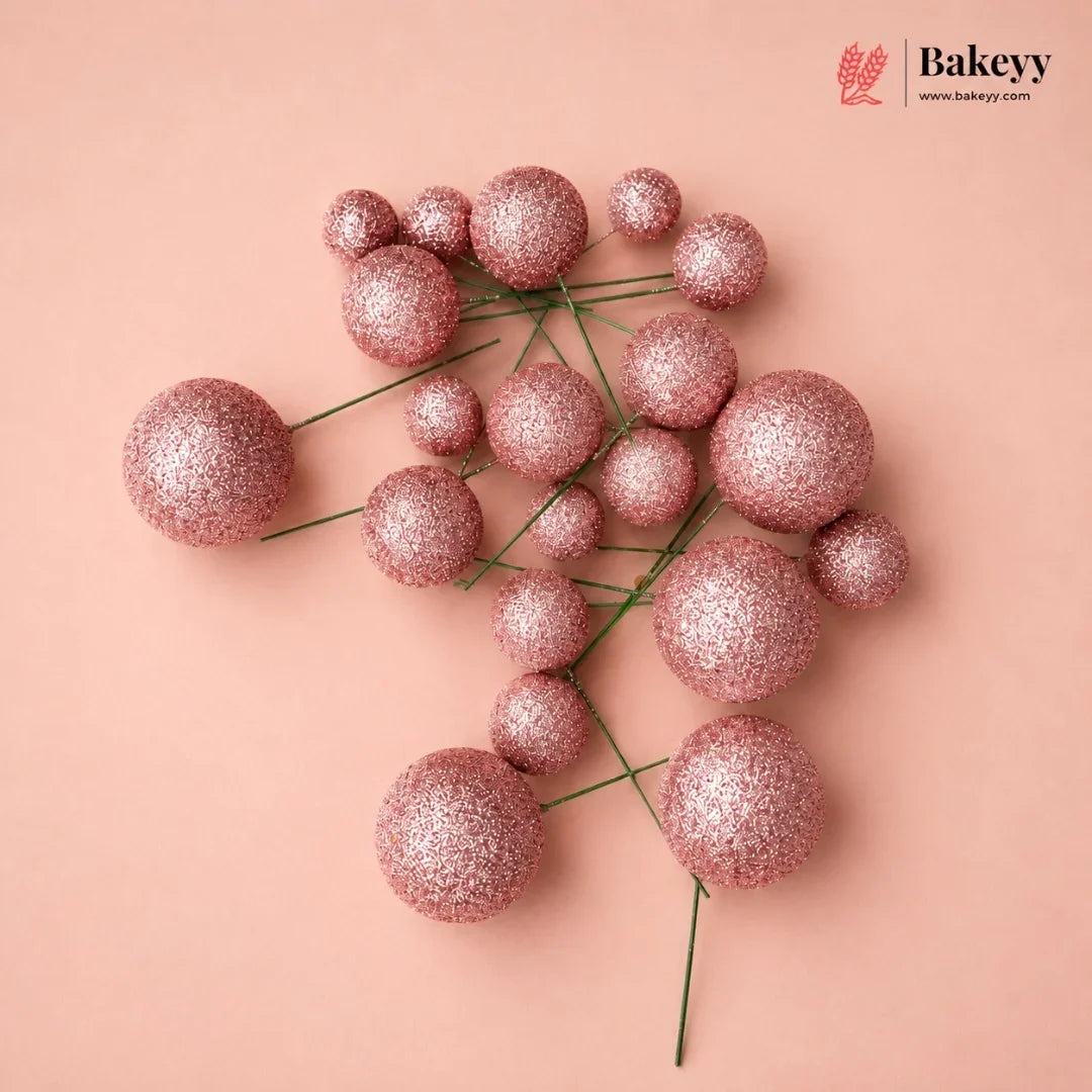 Decorative pink glittery spheres on a beige background with 'Bakeyy' branding.