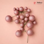 Decorative pink glittery spheres on a beige background with 'Bakeyy' branding.