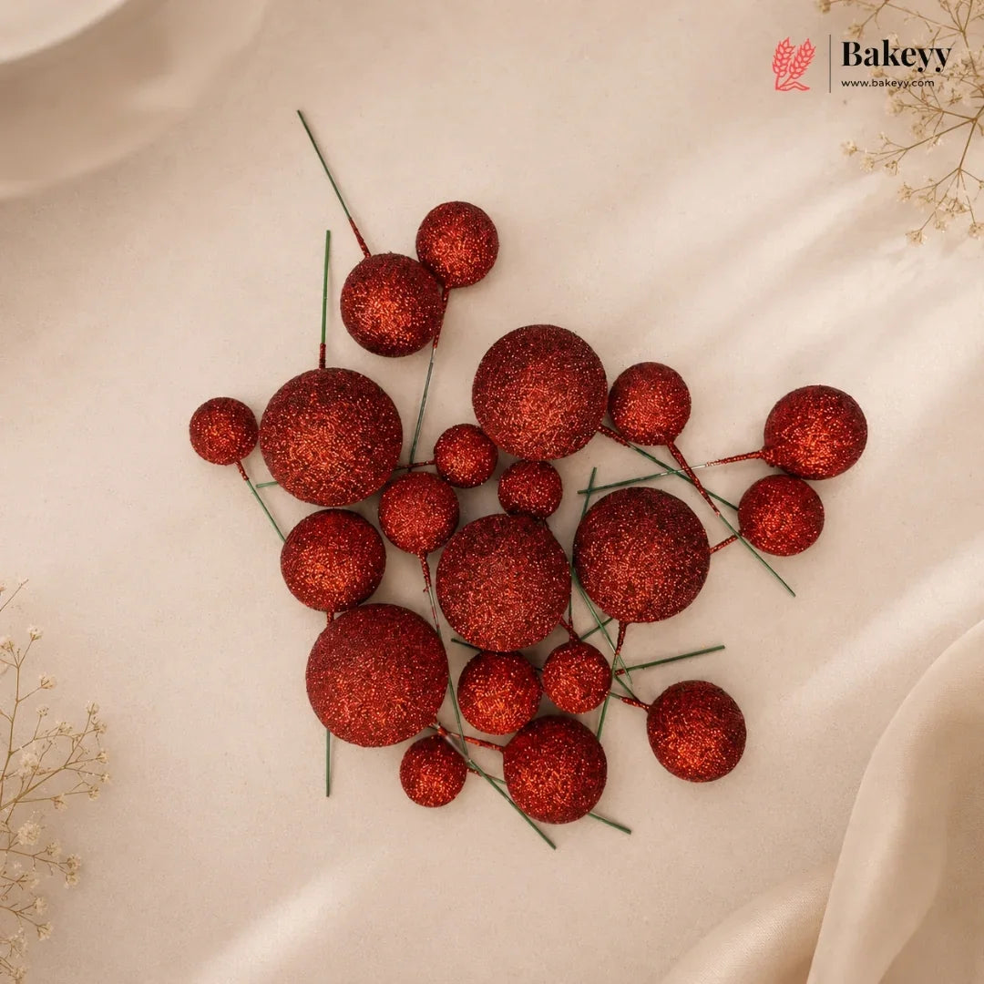 Red decorative balls on a beige fabric background with 'Bakeyv' branding.