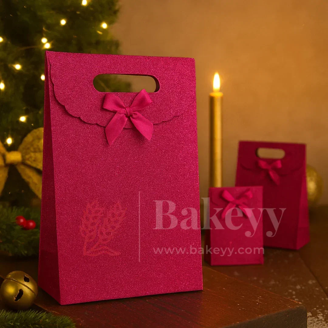 Pink gift bag with a bow and 'Bakeyy' branding in a festive setting.