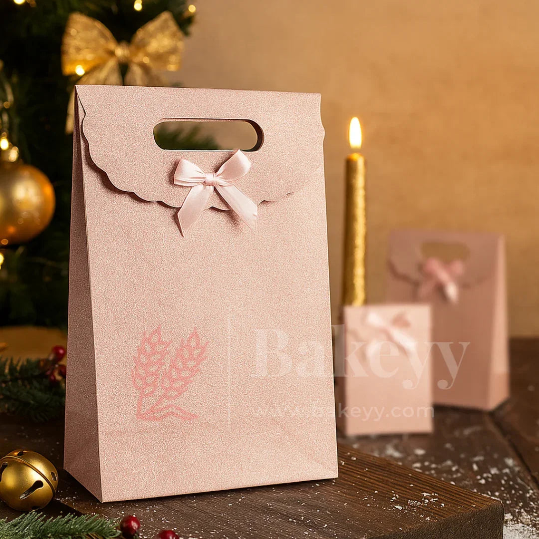 Beige gift bag with pink ribbon and 'Bakeyy' branding on a festive background.