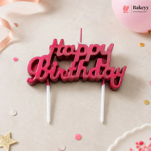 Red 'Happy Birthday' candle topper on a light background with decorative elements.
