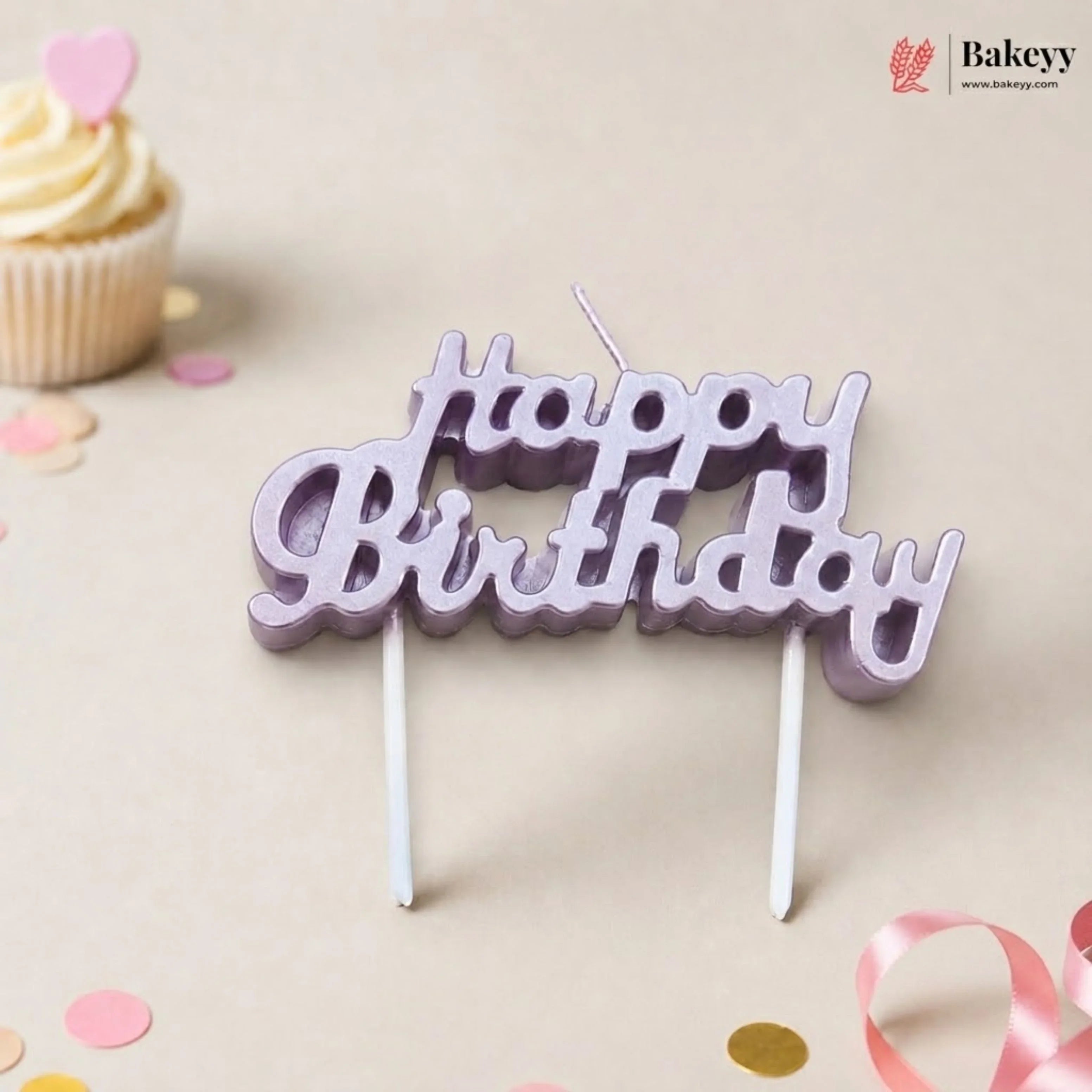 Happy Birthday cake topper with a cupcake and confetti on a light background