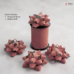 Pink glittery decorative bows with a ribbon roll on a light gray background, featuring the Bakey brand.