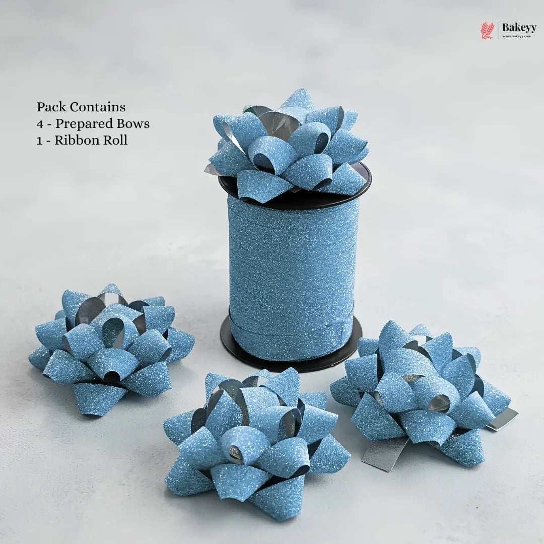 Blue glittery gift bows with a ribbon roll on a light gray background, featuring the Bakeyy brand.