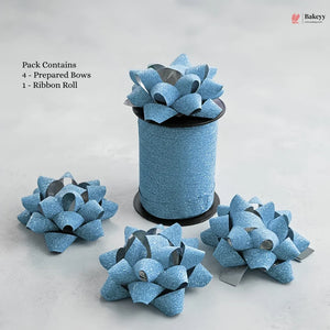 Blue glittery gift bows with a ribbon roll on a light gray background, featuring the Bakeyy brand.