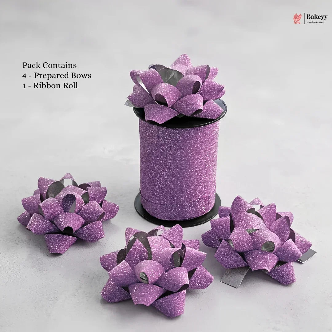 Purple glittery bows with a ribbon roll on a light gray background, featuring Bakeyy branding.