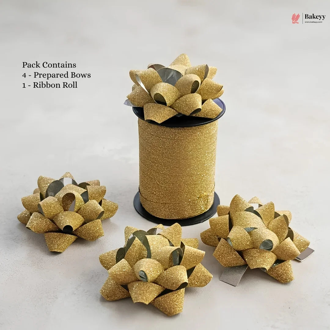 Gold glittery ribbons with prepared bows on a white background, featuring Bakeyy branding.