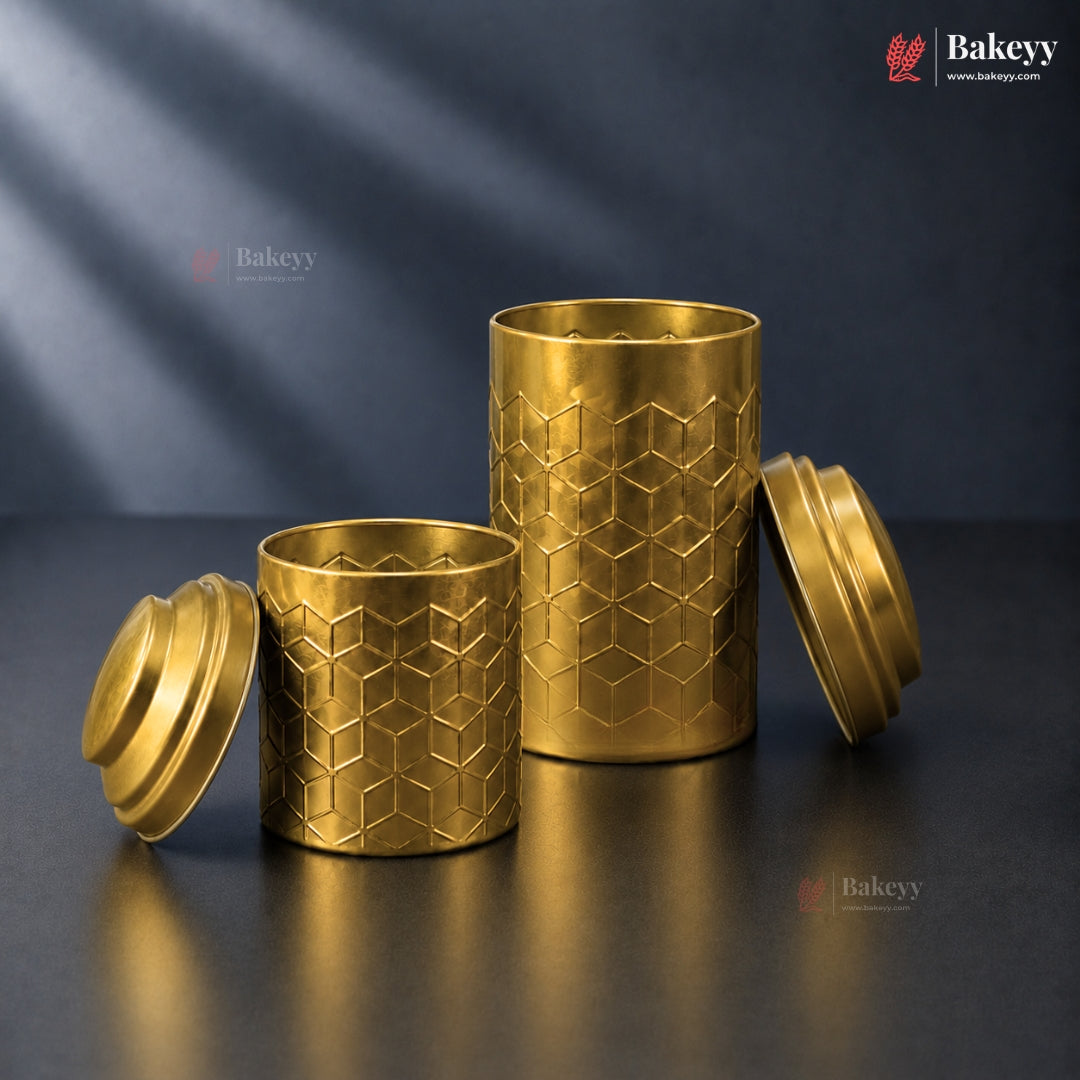 Two gold cylindrical containers with geometric patterns on a dark background, featuring the Bakeey brand.