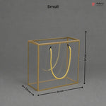 Small gold jewelry display box with dimensions on a gray background