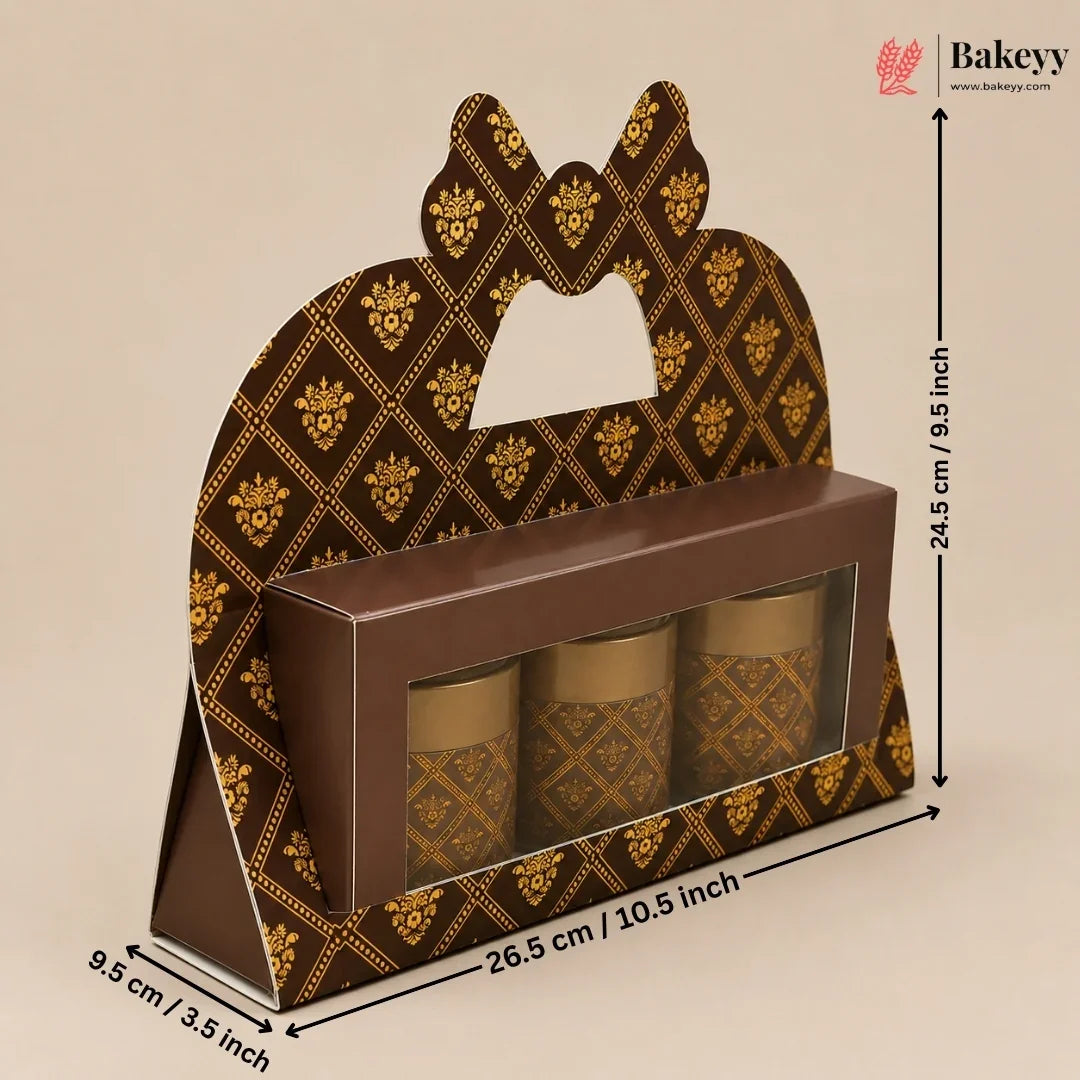 A brown and gold patterned bakery gift box with a handle cutout, shown with dimension arrows and labels indicating 26.5 cm length, 9.