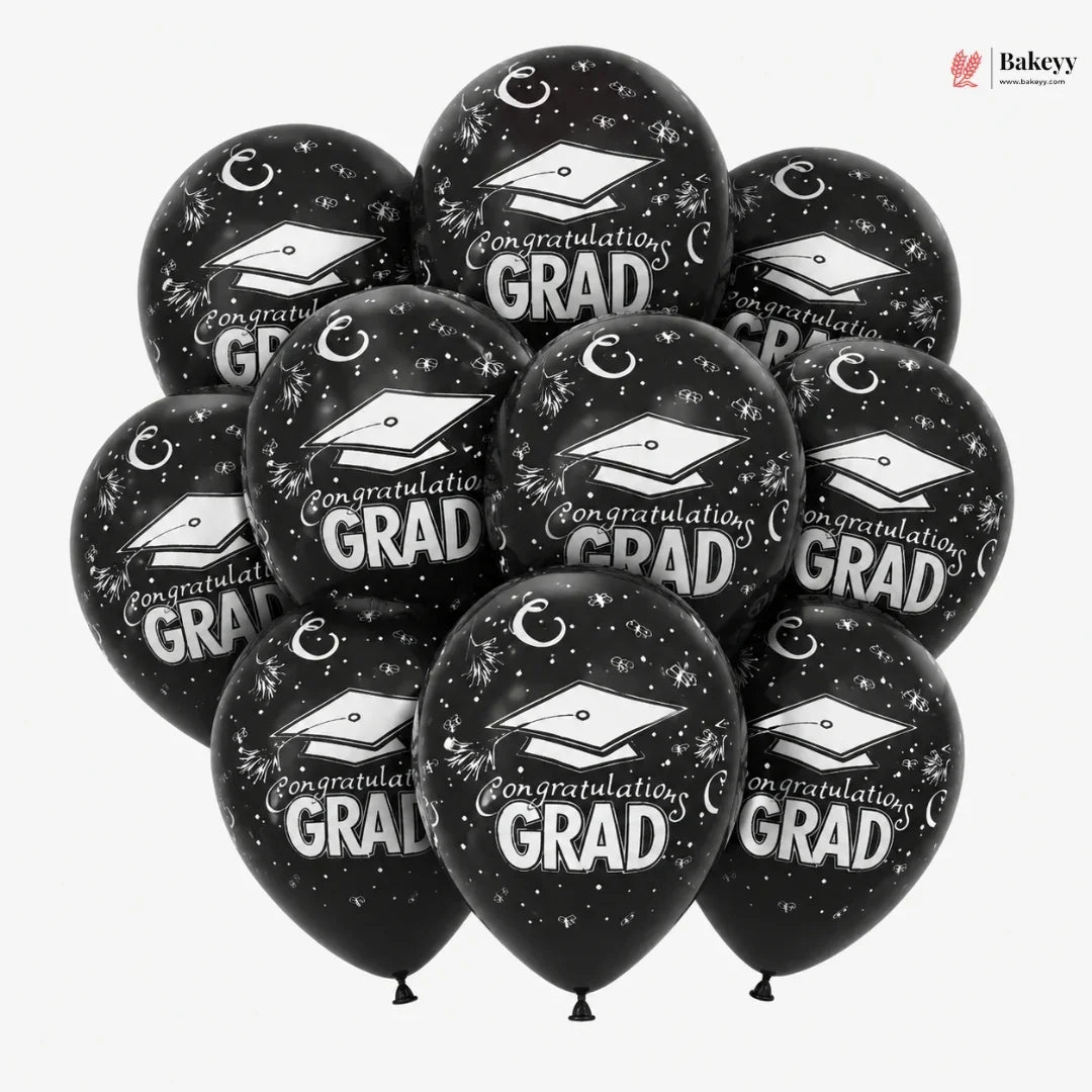Black balloons with 'Congratulations Grad' text and graduation caps on a white background