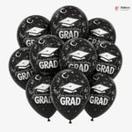 Black balloons with 'Congratulations Grad' text and graduation caps on a white background