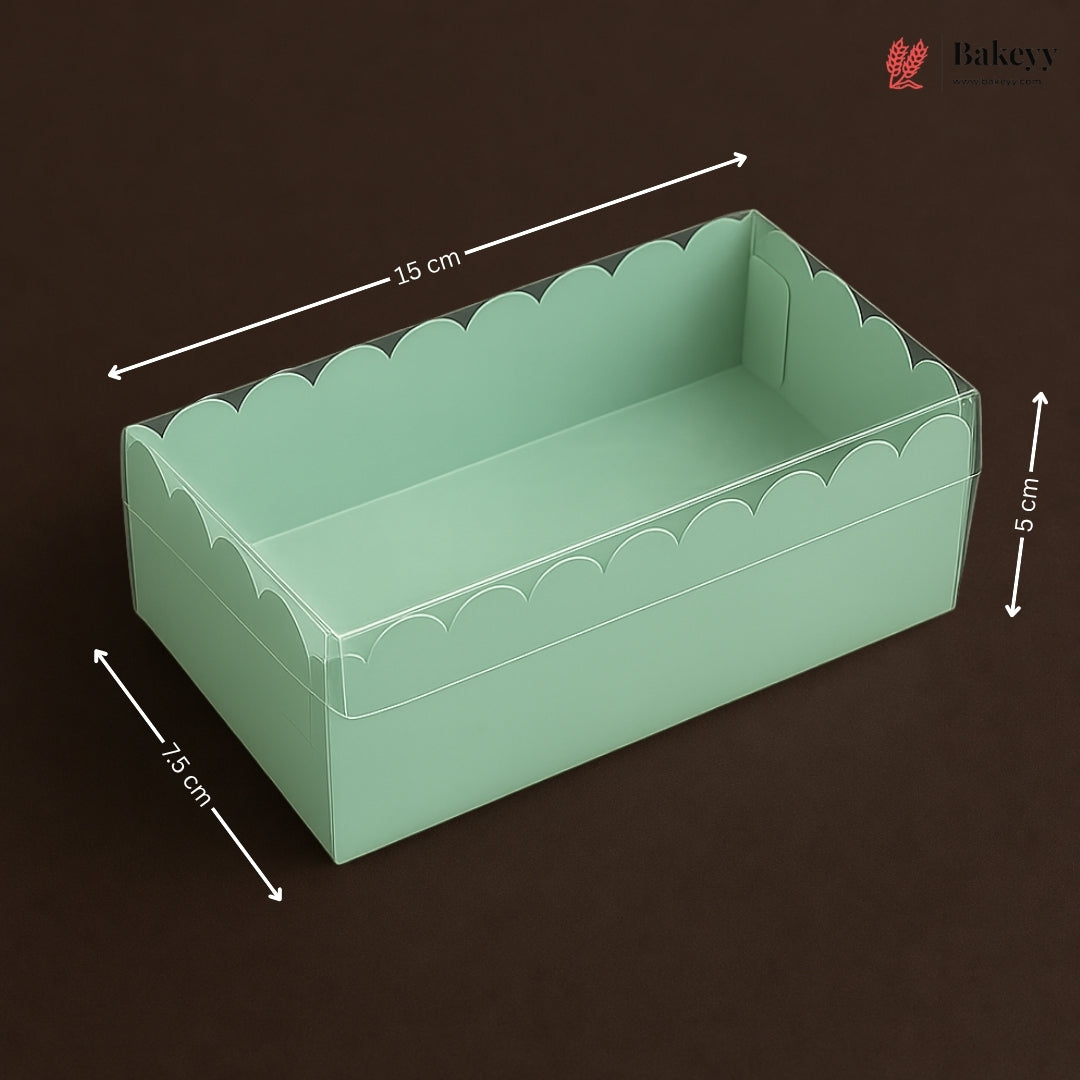 Green scalloped-edge box with dimensions on a dark background