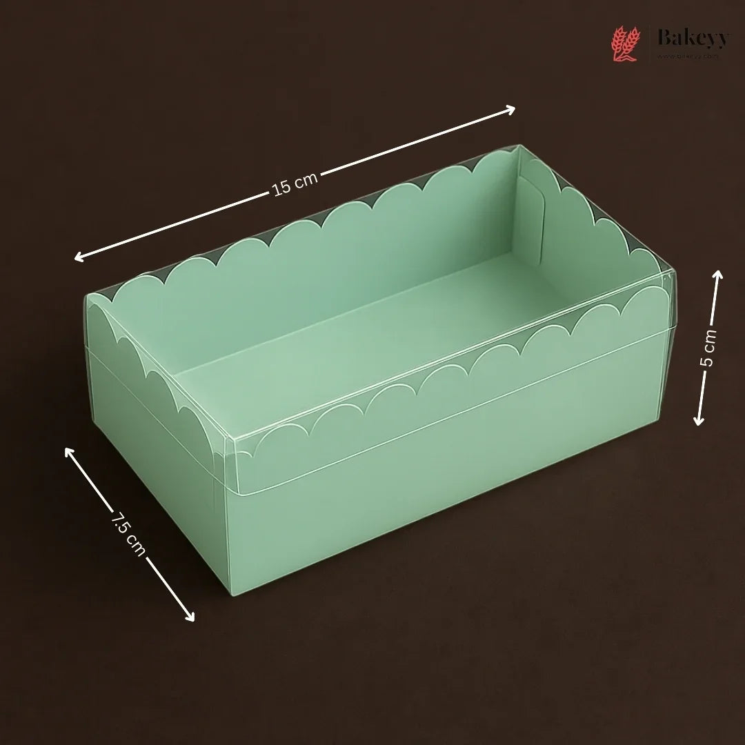 Green scalloped-edge box with dimensions on a dark background