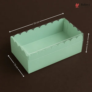 Green scalloped-edge box with dimensions on a dark background
