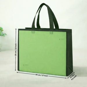 Green tote bag with dimensions on a white background