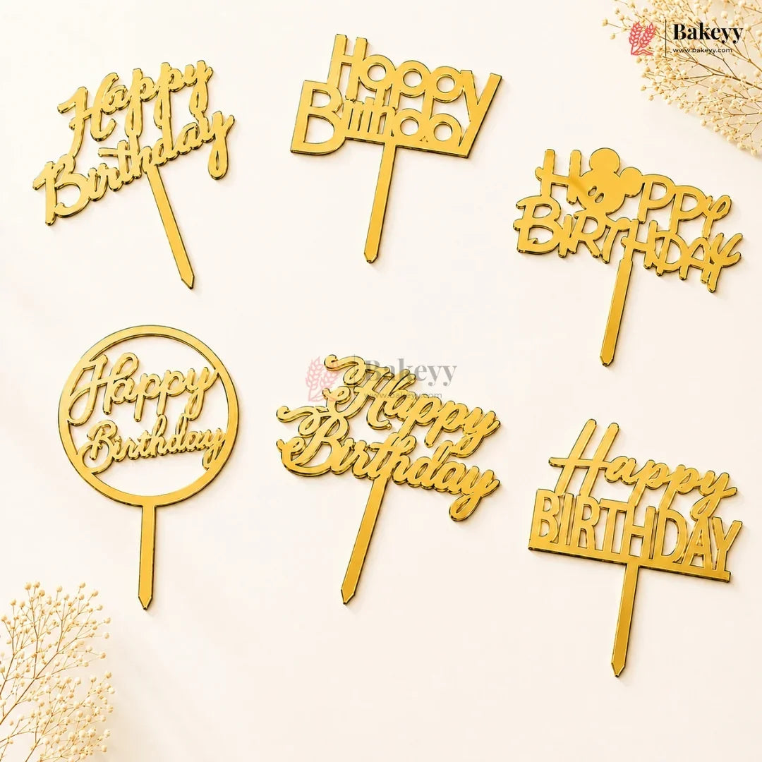 Set of gold 'Happy Birthday' cake toppers on a light background with 'Bakeyy' branding.