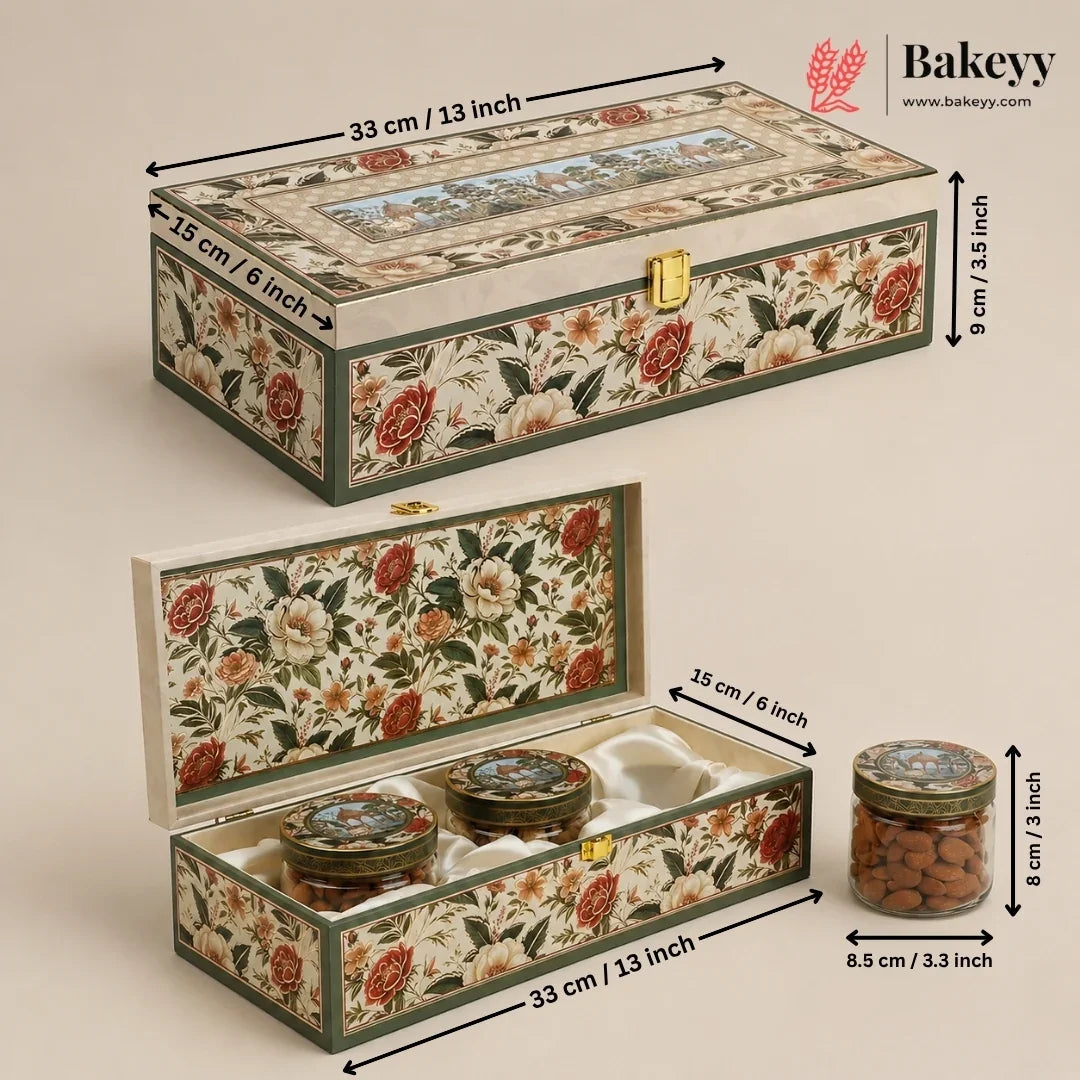 A decorative rectangular storage box with a floral print exterior and interior, shown closed and open with dimension labels. The box has a cream base with red, orange, and green floral pattern, a gold-tone clasp, and a small window on top.