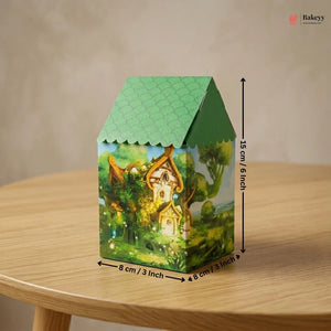 Green house-shaped box with a fairy tale design on a wooden table, featuring dimensions.