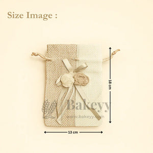 Jute potli bag with floral accents, ribbon, and drawstring, size 18x13 cm, from Bakeyy.com