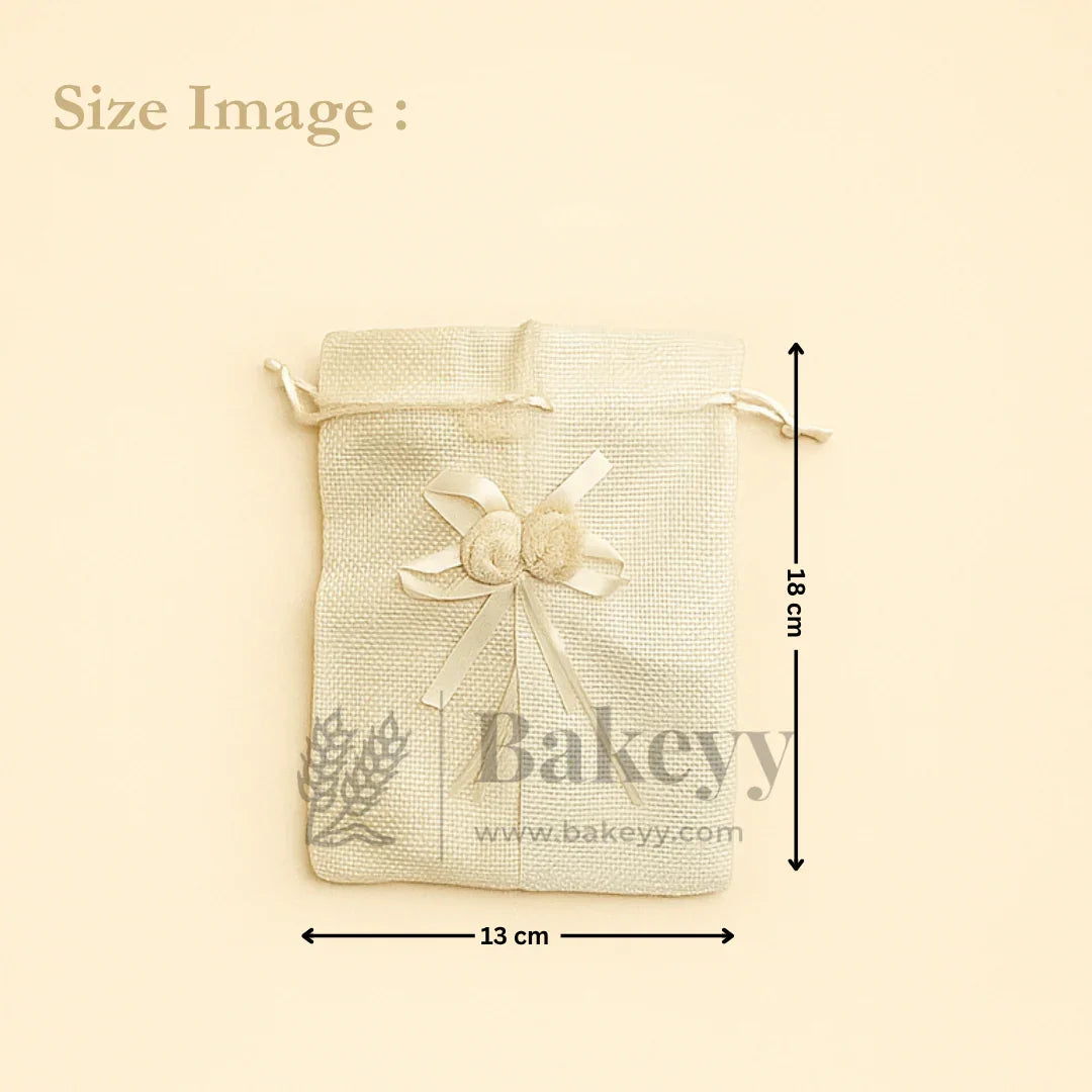 Jute potli gift bag with floral accents, cream ribbon, 13x18 cm, Bakeyy gift packaging.