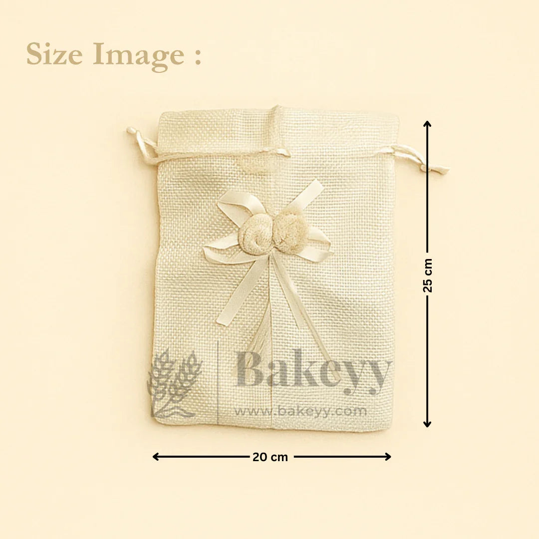 Cream jute potli bag with ribbon and floral accents, 20x25 cm, for gift packaging by Bakeyy