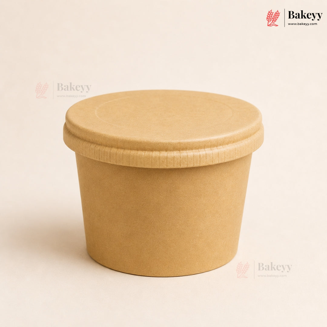 Brown paper cup with a lid on a beige background, featuring the Bakeyy brand.