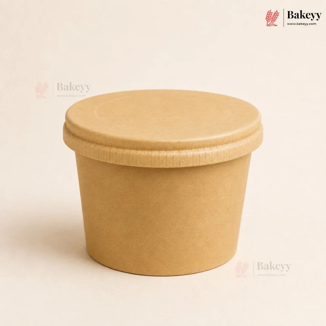 Brown paper cup with a lid on a beige background, featuring the Bakeyy brand.