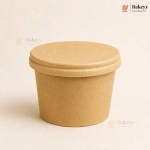 Brown paper cup with a lid on a beige background, featuring the Bakeyy brand.