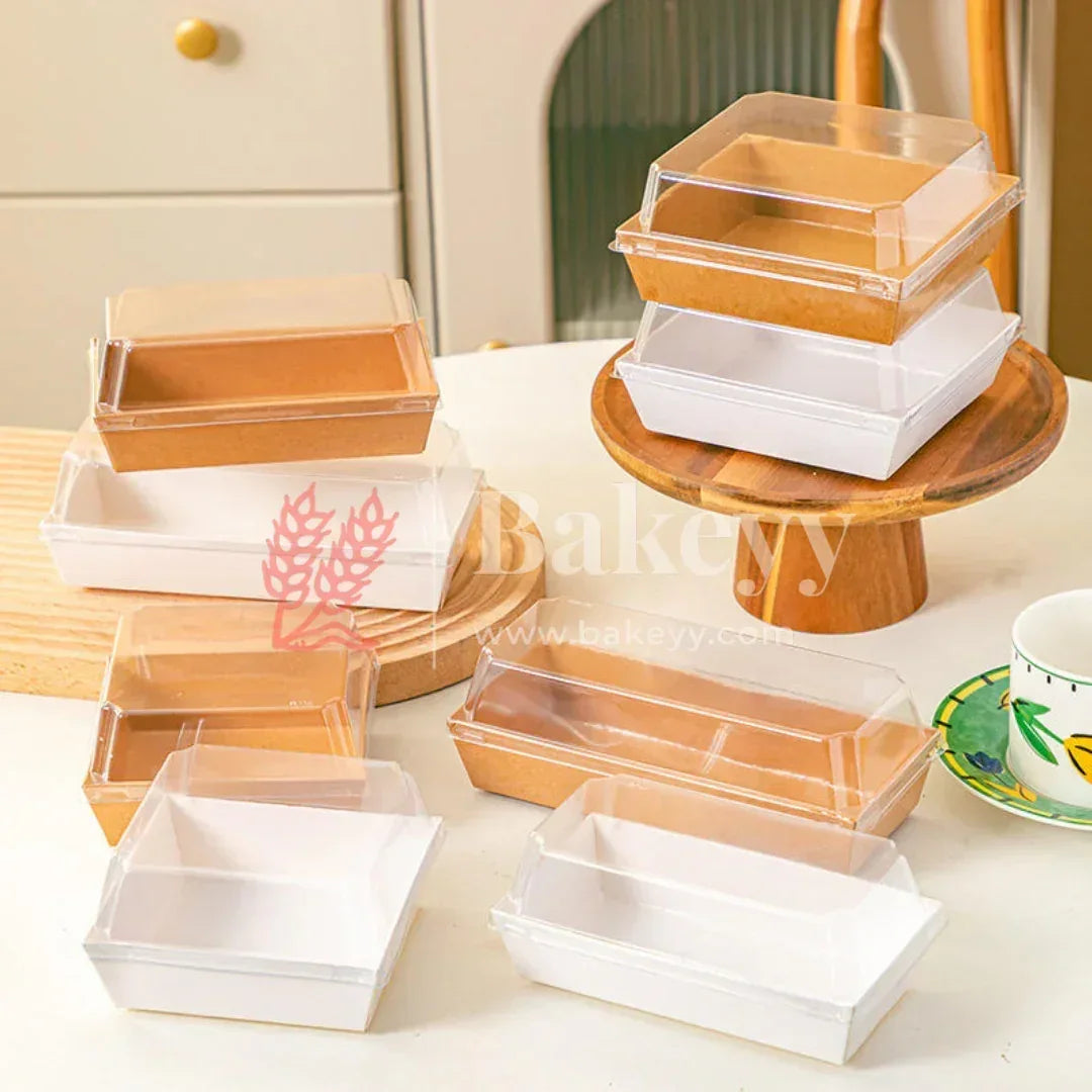Collection of clear plastic food containers on a table with a Bakery logo in the background.