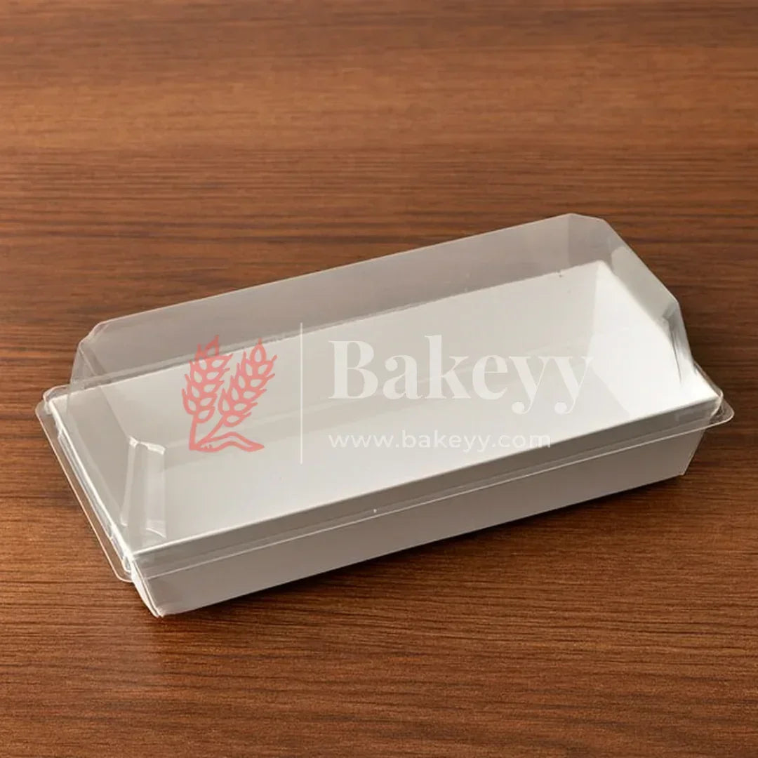 Clear plastic tray with lid on a wooden surface, featuring the 'Bakey' brand.