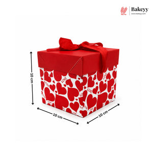 Red gift box with heart pattern and dimensions on a white background, featuring the brand 'Bakeyy'.