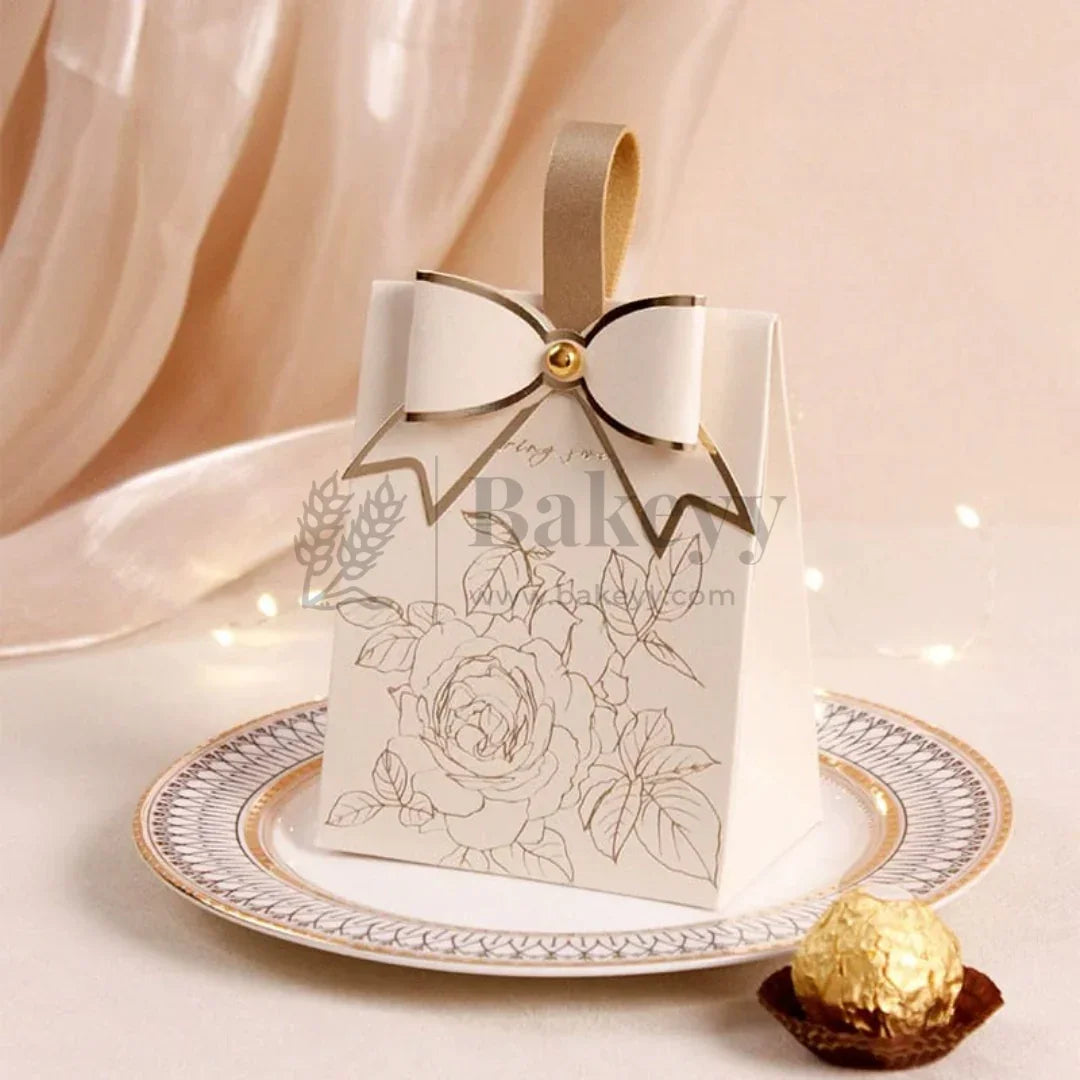 Decorative gift box with floral design on a plate with a blurred background