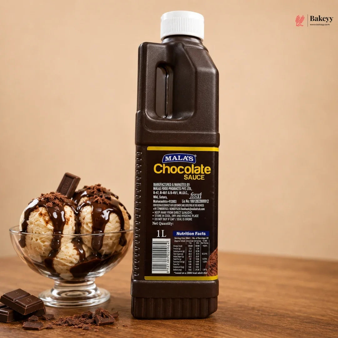 Bottle of Malas chocolate sauce with a bowl of ice cream on a wooden surface.