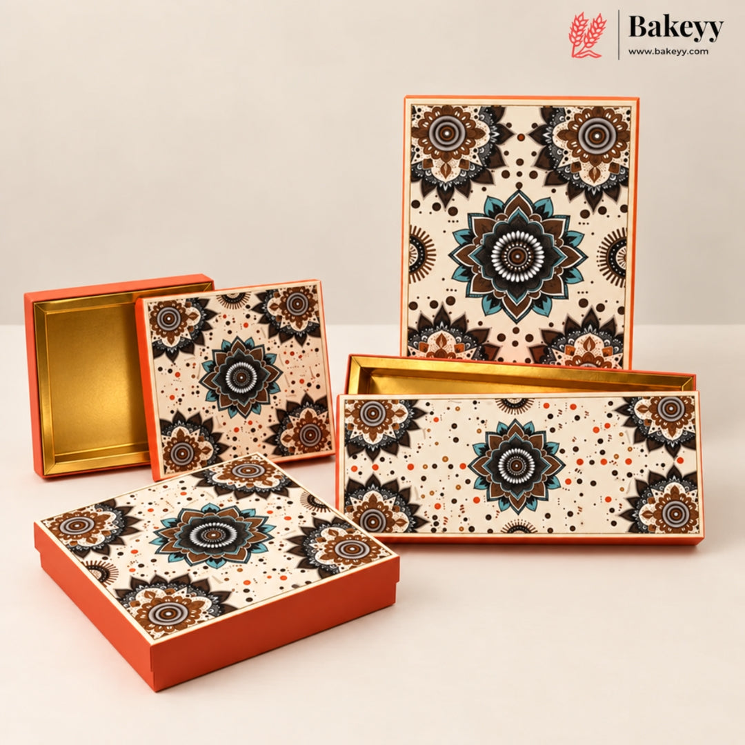 A set of decorative rectangular gift boxes with a cream background and intricate black, brown, and teal mandala patterns, accented with orange borders and gold interior linings. One box is open, showing the gold interior, and the rest are closed.