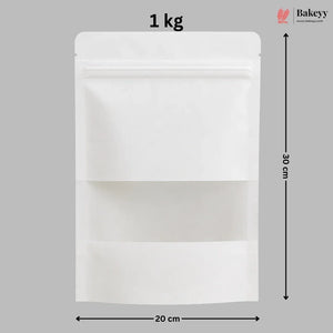 A white stand-up pouch packaging bag with a zipper closure and a clear window, shown with dimension markings of 30 cm height and 20 cm width on a gray background, with a Bakeyy logo in the top right.