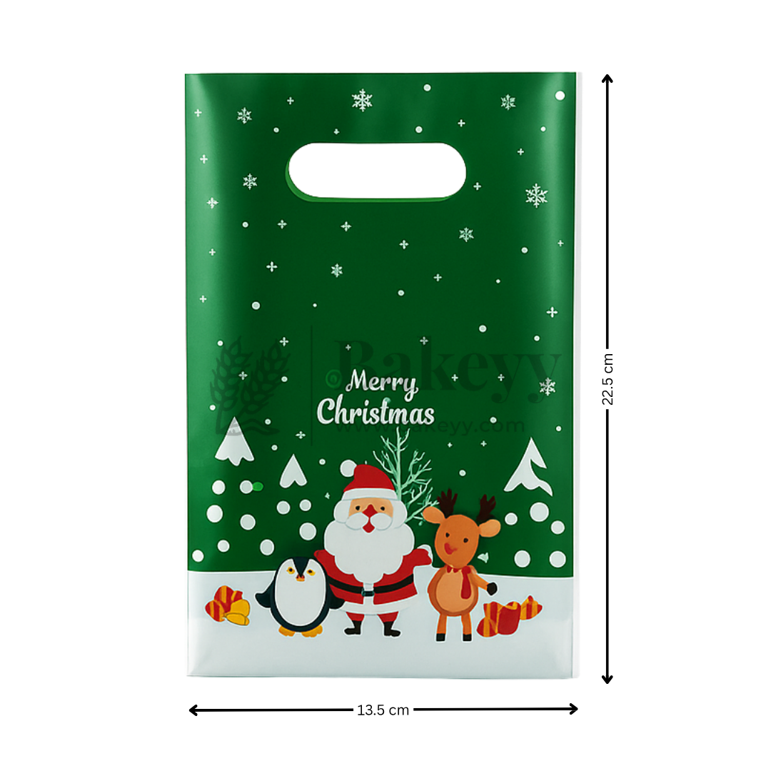 Christmas-themed gift bag with Santa Claus, reindeer, penguin, and snowflakes on a green background.