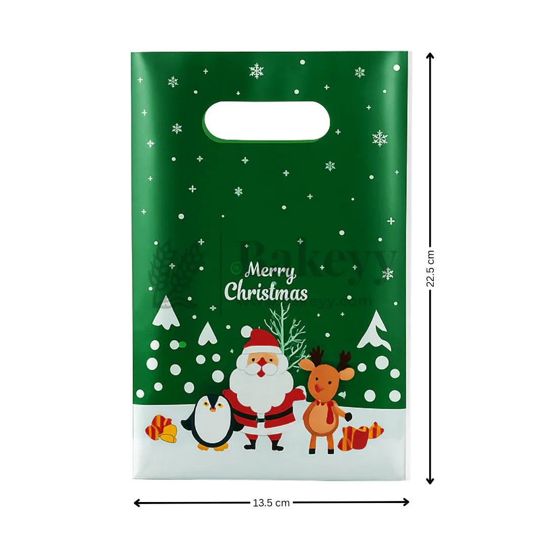 Christmas-themed gift bag with Santa Claus, reindeer, penguin, and snowflakes on a green background.