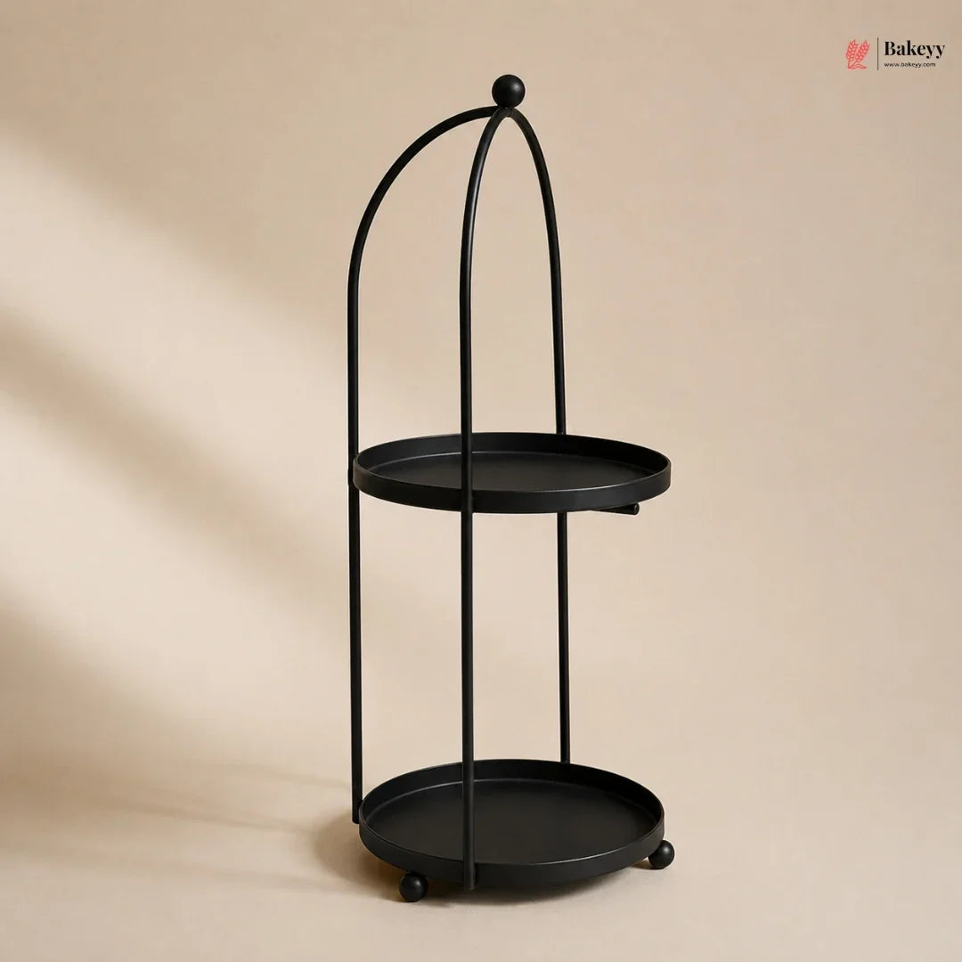 Black metal stand with two round shelves on a beige background
