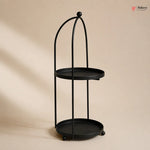 Black metal stand with two round shelves on a beige background